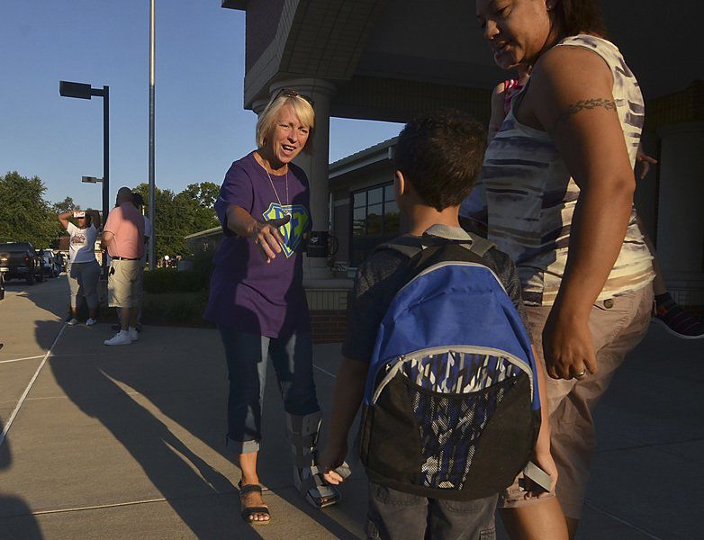 As kids return, crossing guards take up job they love